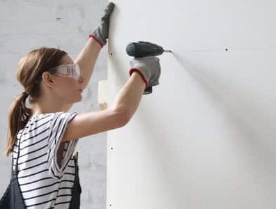 screwing plaster board to the wall