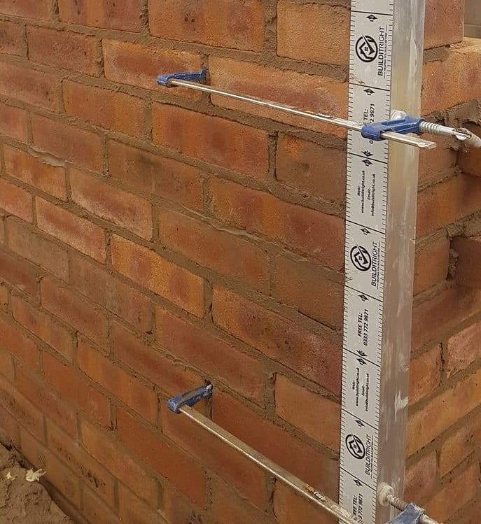 Bricklayers profiles with gauge tape and clamps